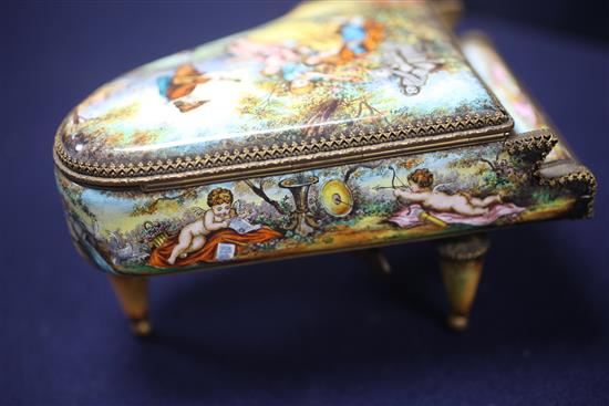 Two 20th century Viennese enamel musical boxes, in the form of a piano and a cello with stand, 6.5in. & 11.5in.